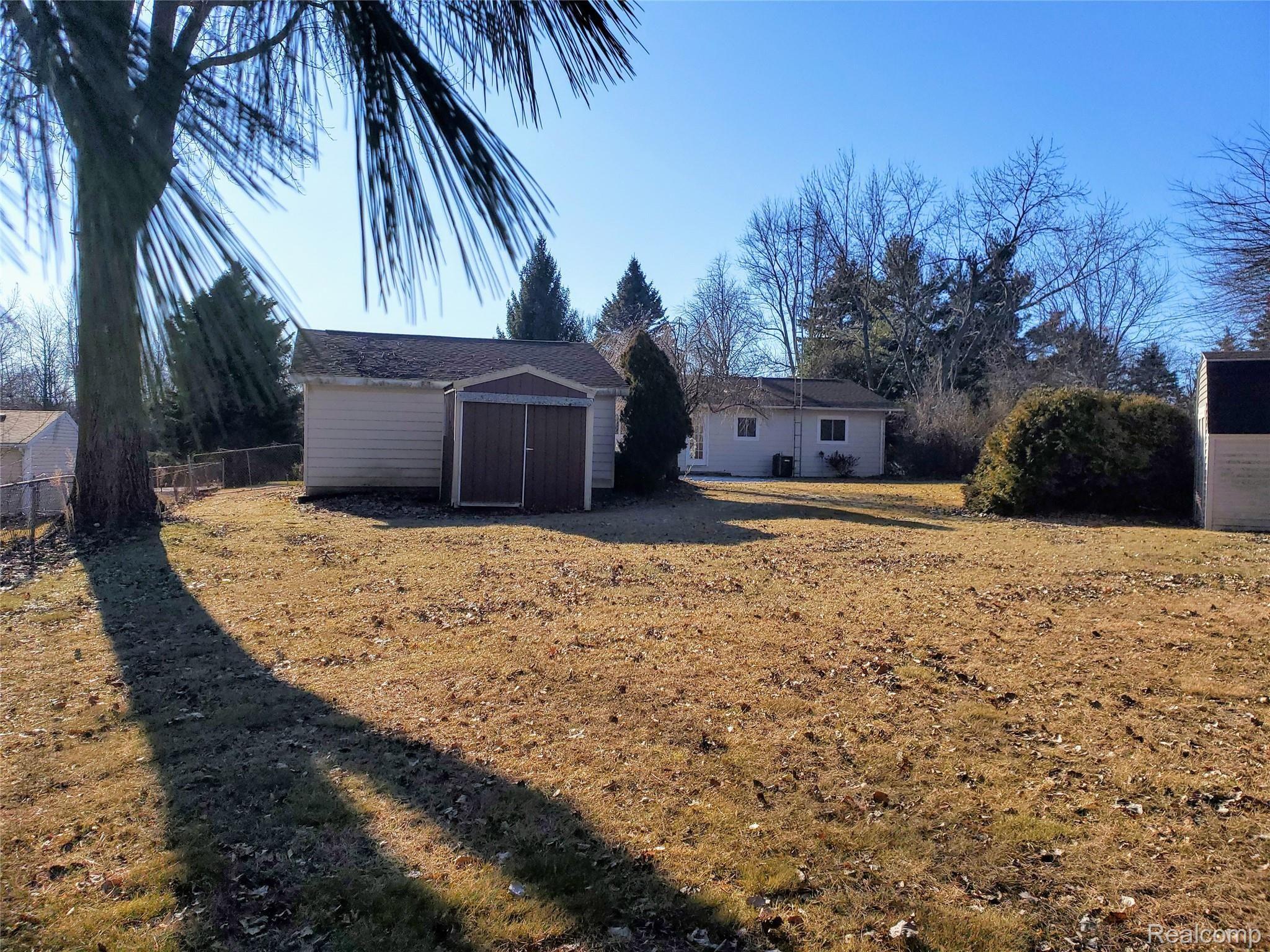 8387 East Baldwin Road Goodrich, MI 48438 - Photo 5 of 26 Baldwin Looking at House Gar and Sheds from back of the yard.jpg