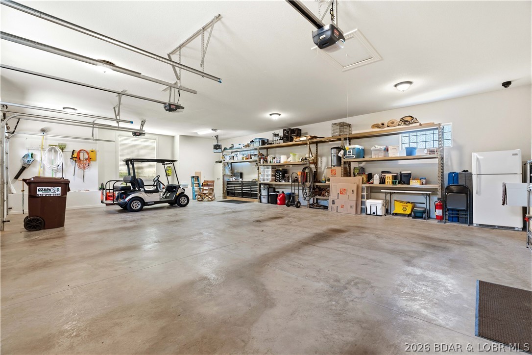 1015 Anemone Road Lake Ozark, MO 65049 - Photo 63 of 100 Oversized 3 car garage with storage