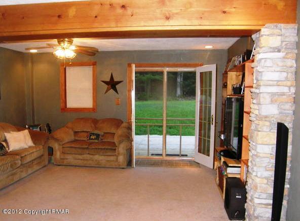 1415 Davids Road Effort, PA 18330 - Photo 15 of 35 a living room with furniture and a chandelier