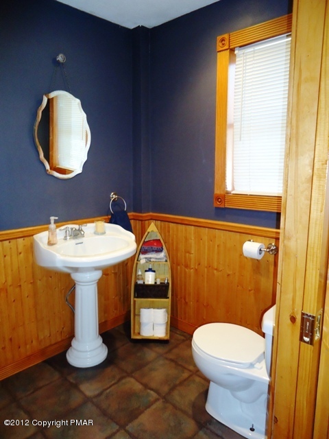 1415 Davids Road Effort, PA 18330 - Photo 17 of 35 a bathroom with a sink mirror and toilet