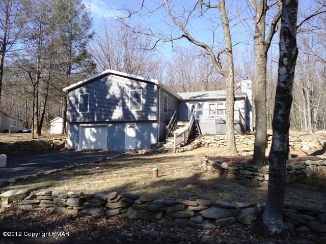 1415 Davids Road Effort, PA 18330 - Photo 2 of 35 a view of a house with large tree next to a road