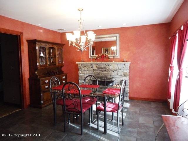 1415 Davids Road Effort, PA 18330 - Photo 4 of 35 a view of a dining room with furniture and chandelier