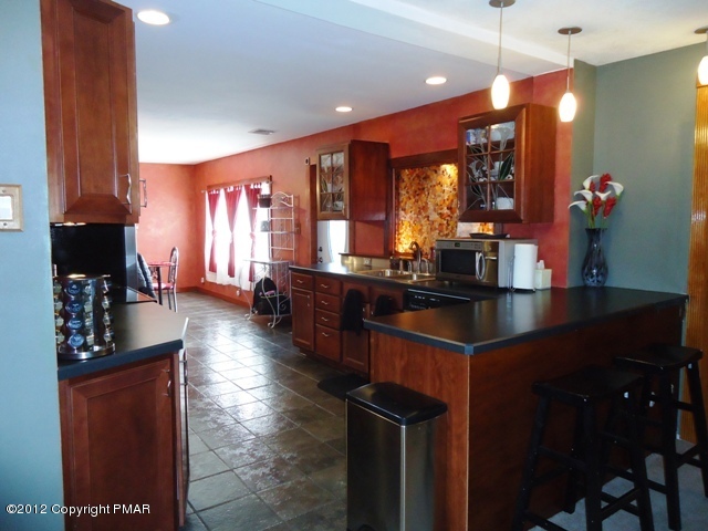 1415 Davids Road Effort, PA 18330 - Photo 8 of 35 a kitchen with counter top space a sink and cabinets