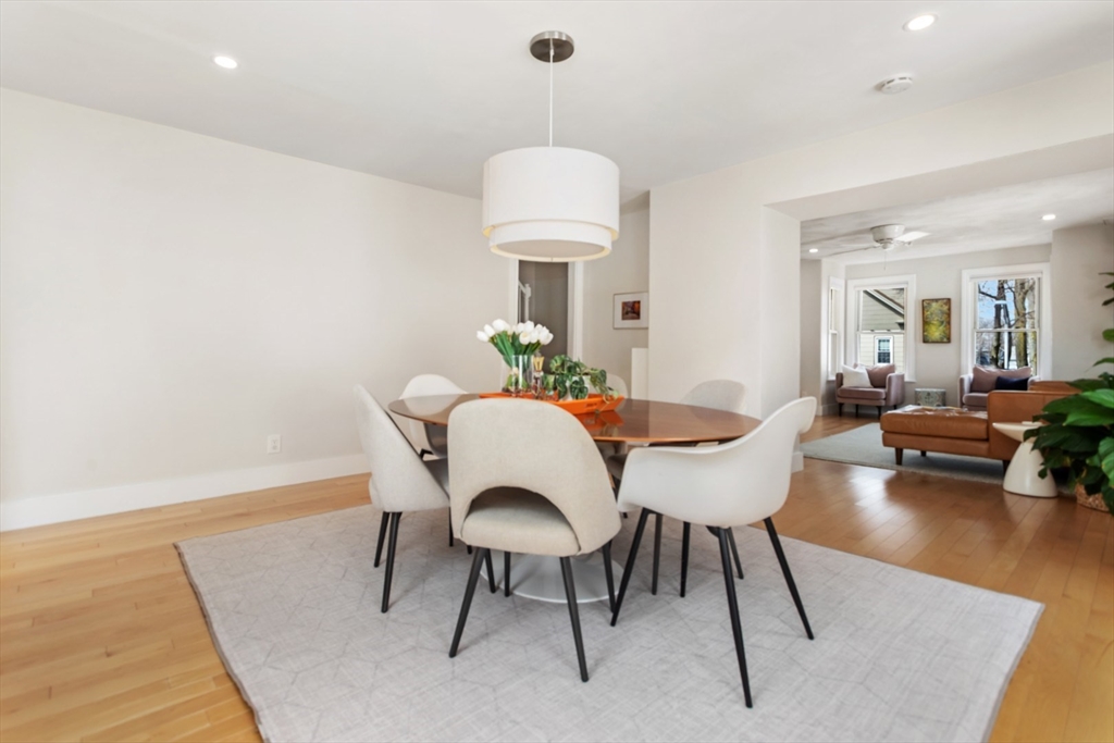 52 Chestnut Street Wakefield, MA 01880 - Photo 14 of 42 a dining room with furniture a chandelier and wooden floor