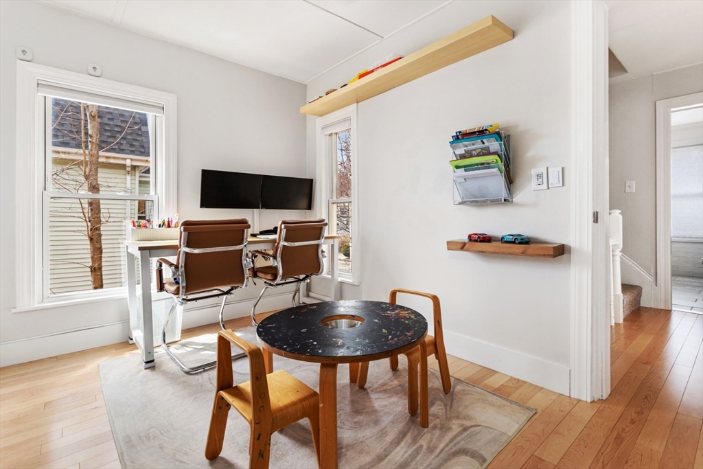 52 Chestnut Street Wakefield, MA 01880 - Photo 16 of 42 a workspace with furniture and wooden floor