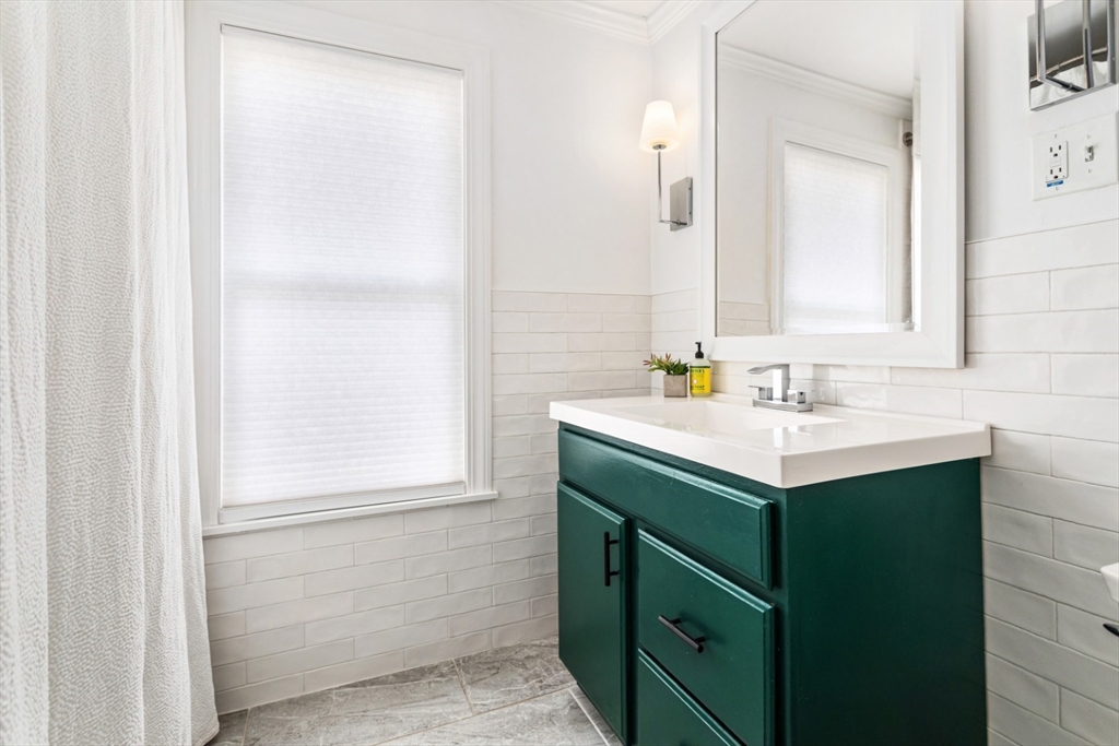 52 Chestnut Street Wakefield, MA 01880 - Photo 18 of 42 a bathroom with a sink and a mirror