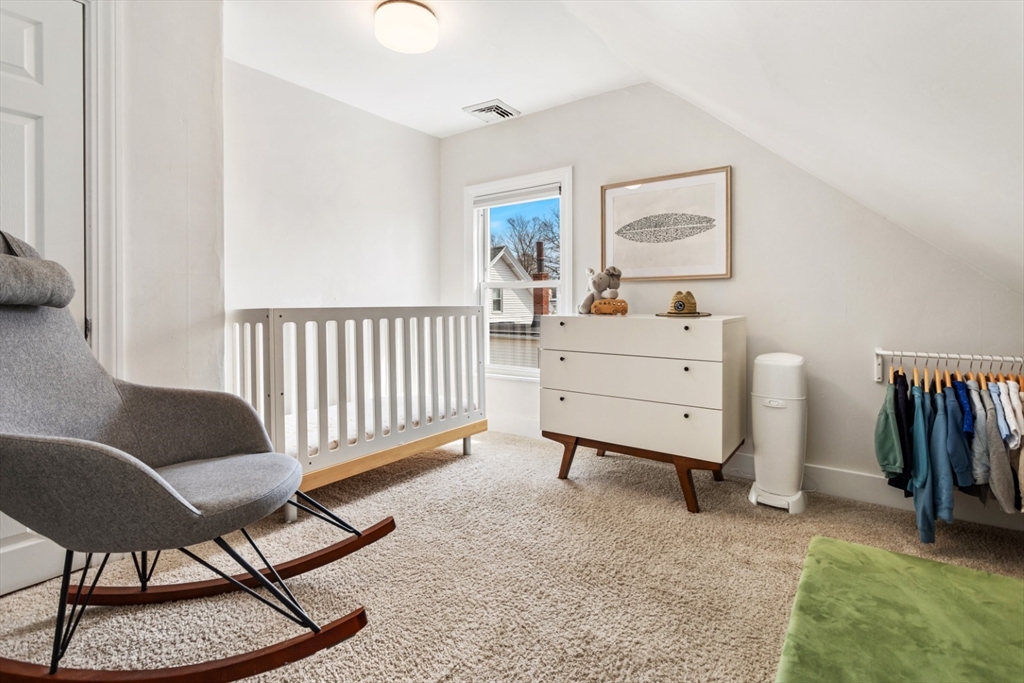 52 Chestnut Street Wakefield, MA 01880 - Photo 26 of 42 a room with furniture and a window