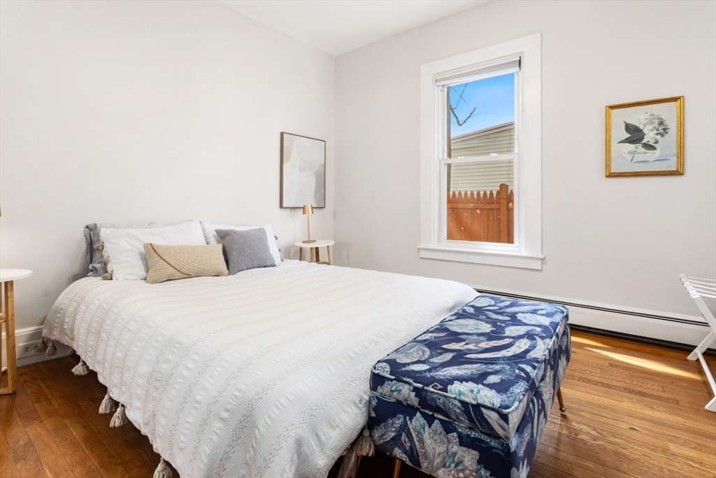 52 Chestnut Street Wakefield, MA 01880 - Photo 32 of 42 a bedroom with a bed and a window