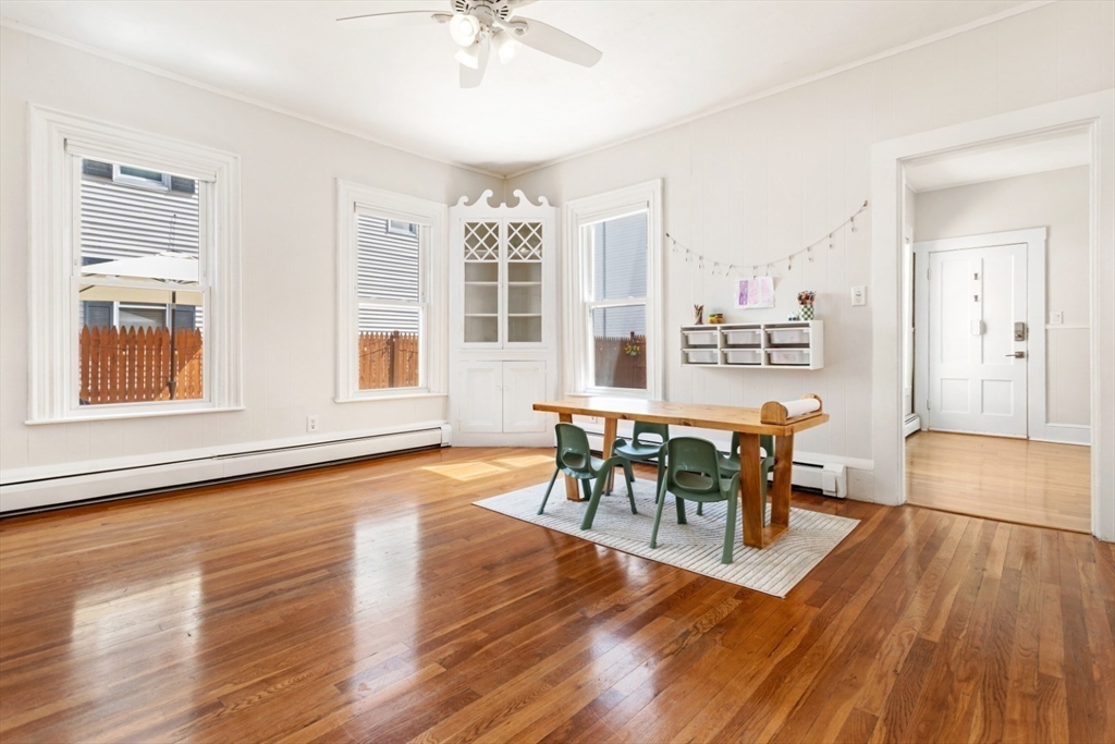 52 Chestnut Street Wakefield, MA 01880 - Photo 35 of 42 a view of a dining room with furniture and wooden floor
