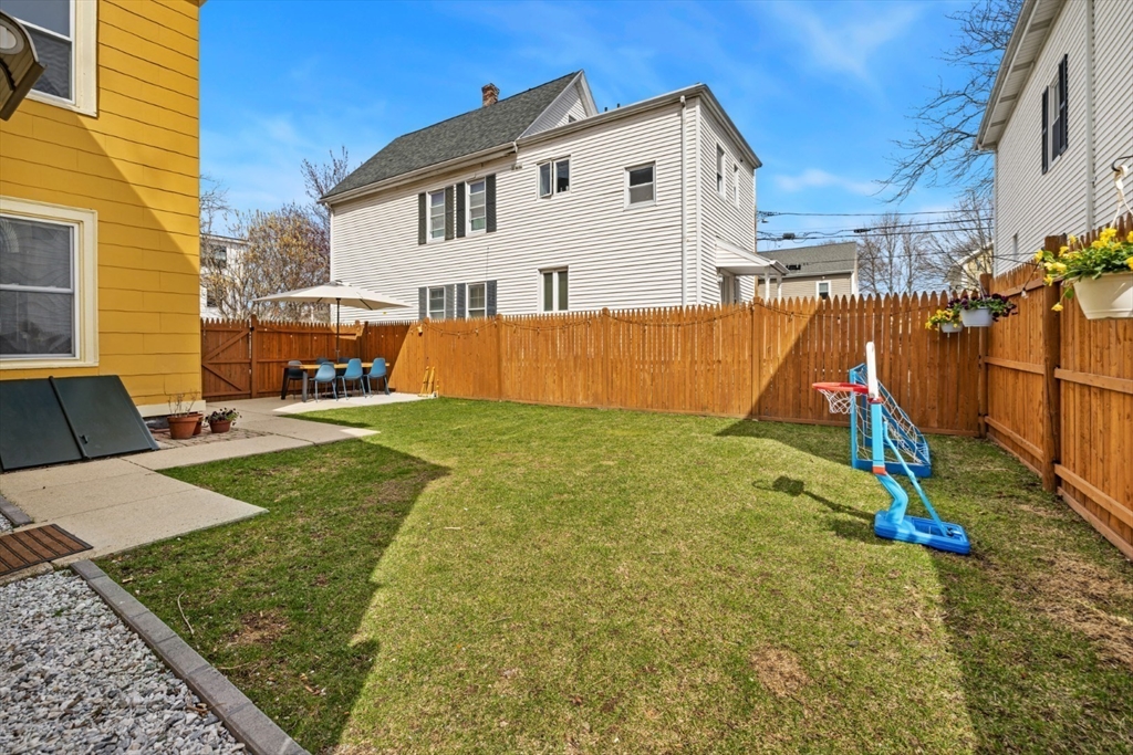 52 Chestnut Street Wakefield, MA 01880 - Photo 39 of 42 a view of a backyard with a house