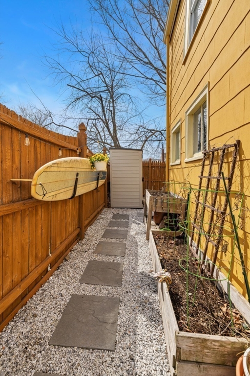 52 Chestnut Street Wakefield, MA 01880 - Photo 40 of 42 a view of a backyard with wooden fence