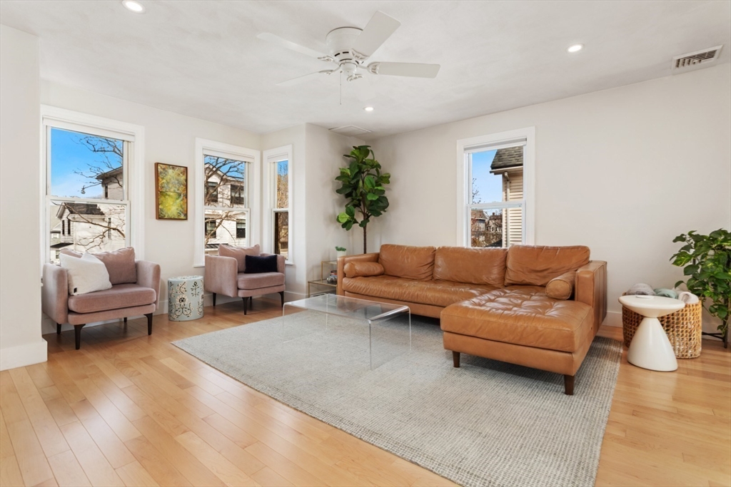 52 Chestnut Street Wakefield, MA 01880 - Photo 10 of 42 a living room with furniture and a potted plant