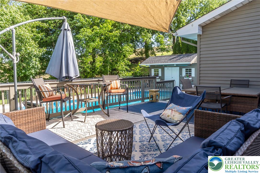 540 Briar Road Pen Argyl, PA 18072 - Photo 39 of 66 An inviting deck offers generous outdoor living and dining spaces next to a sparkling pool.