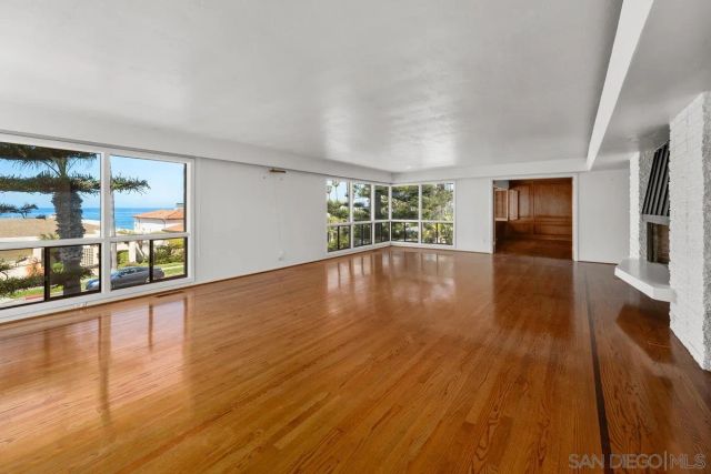 a view of kitchen with wooden floor and a sink