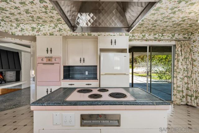 a kitchen with cabinets and window