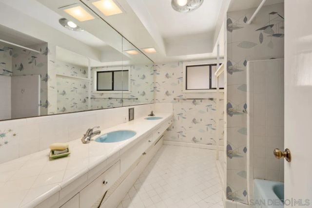 a view of a room with wooden floor and windows