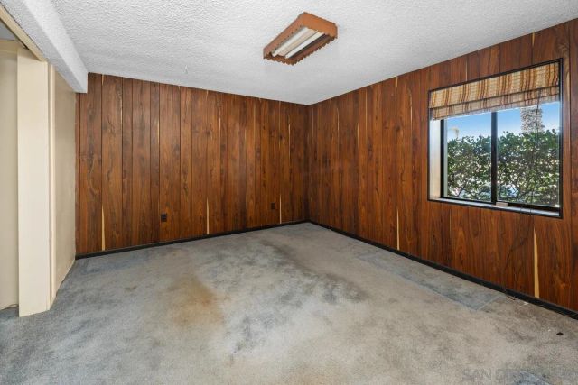 a view of a porch with a table and chairs