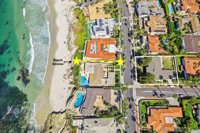 an aerial view of houses with yard