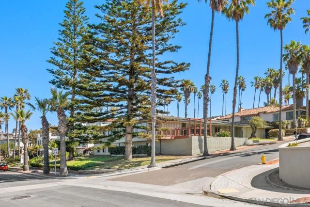 a view of a patio with table and chairs with wooden fence and plants