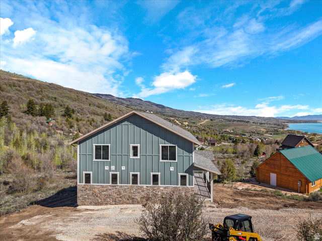 1159 North Broad Hollow Road Garden City, UT 84028 - Photo 21 of 55 Contemporary home featuring board and batten siding, a stone facade, and multiple window placements