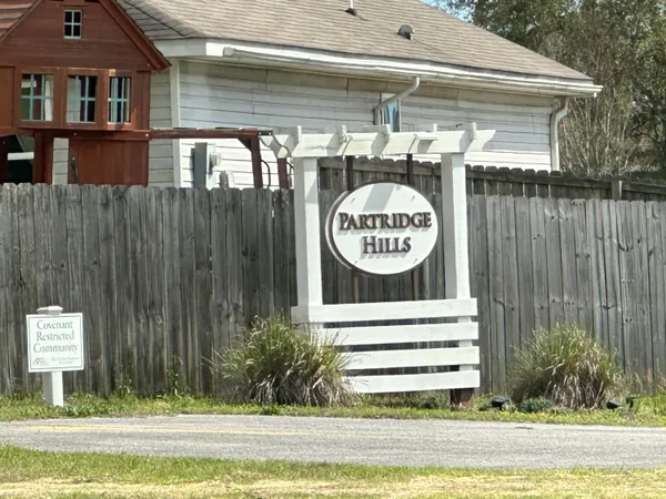 a view of a sign board with a small house