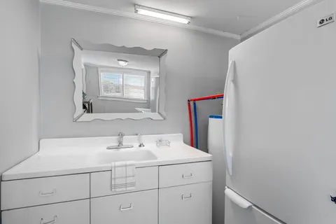 a bathroom with a sink and a mirror