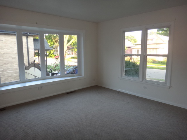 192 East Quincy Street Riverside, IL 60546 - Photo 2 of 11 an empty room with a window
