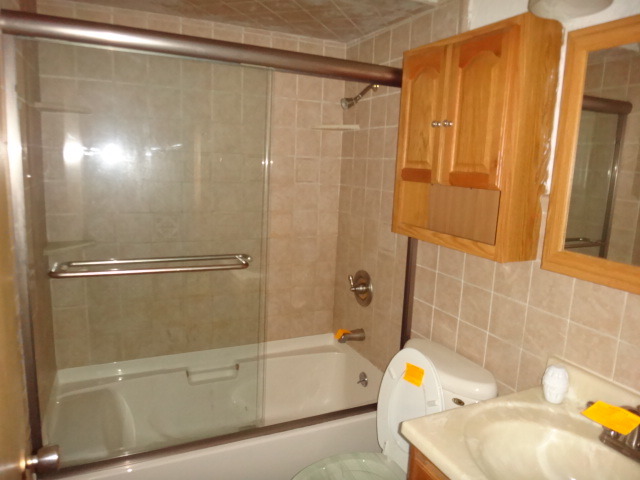 192 East Quincy Street Riverside, IL 60546 - Photo 11 of 11 a bathroom with a tub and shower