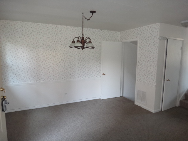 192 East Quincy Street Riverside, IL 60546 - Photo 4 of 11 a view of empty room with a chandelier