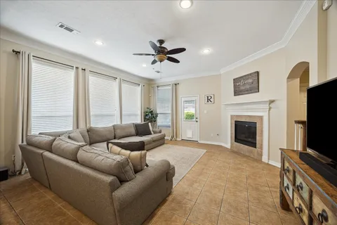 a living room with furniture and a large window