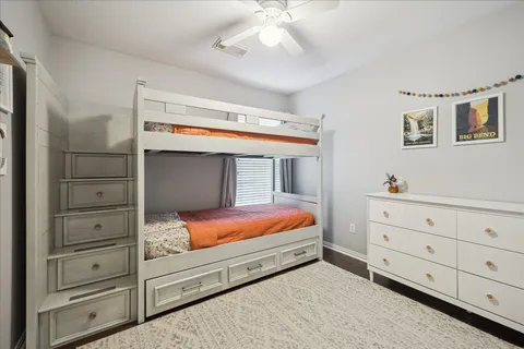 a bathroom with a toilet and shower