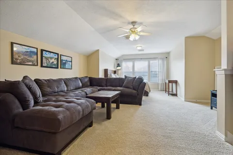a spacious bedroom with a bed and window