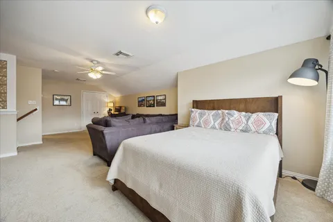 a bathroom with a sink shower and a mirror