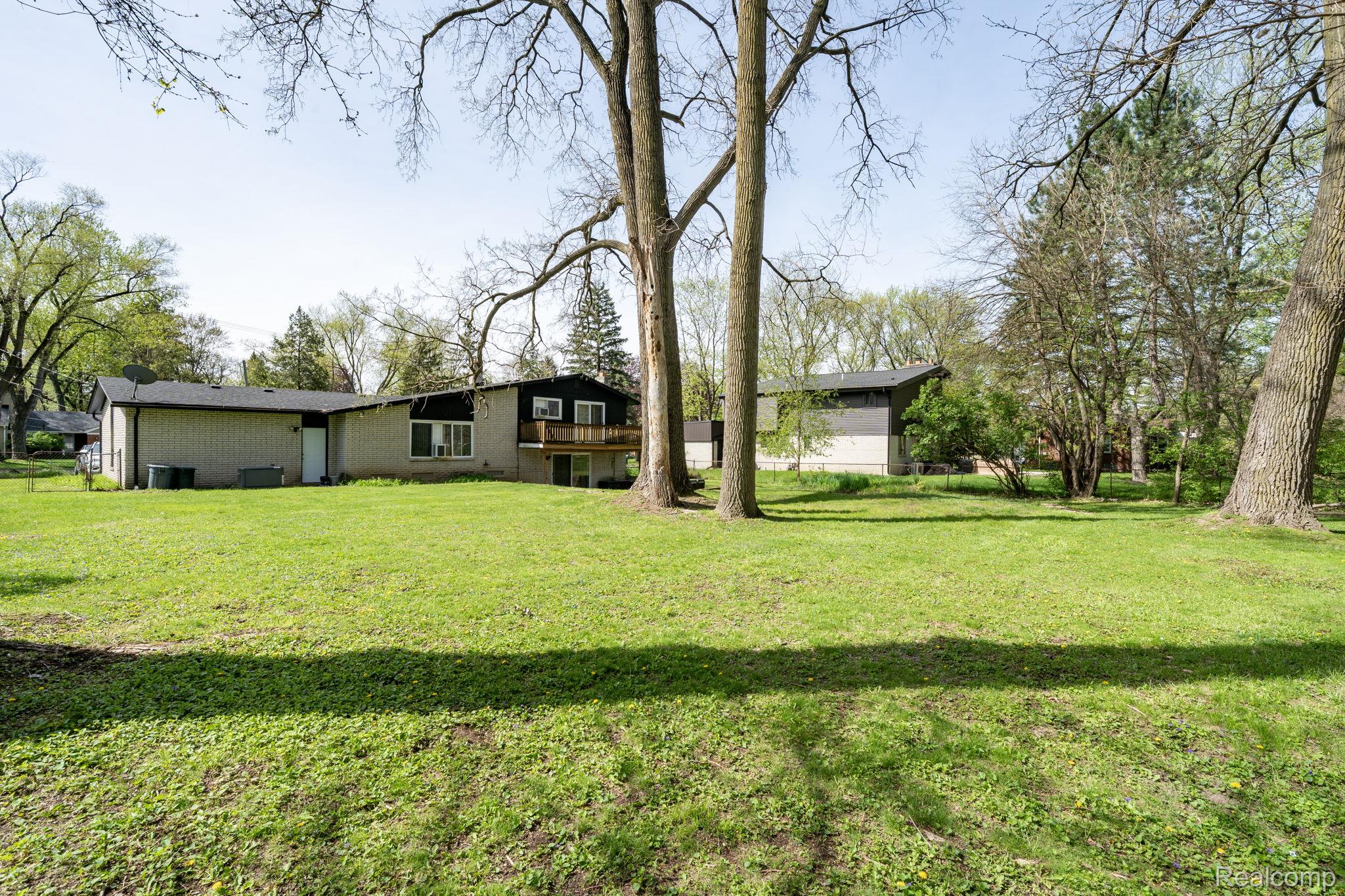 19650 Midway Road Southfield, MI 48075 - Photo 30 of 30 Back of property featuring a lawn