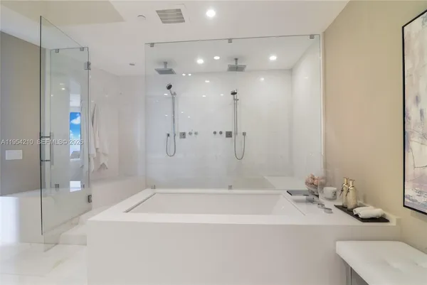 a bathroom with a bathtub and a sink