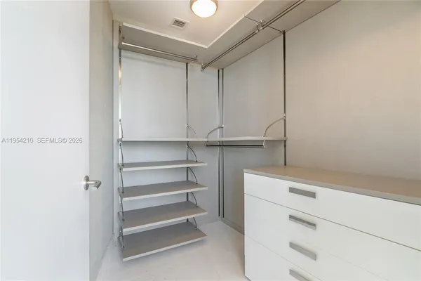 a view of an empty walk in closet