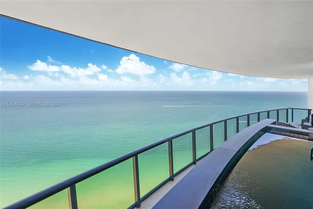 a view of balcony with ocean