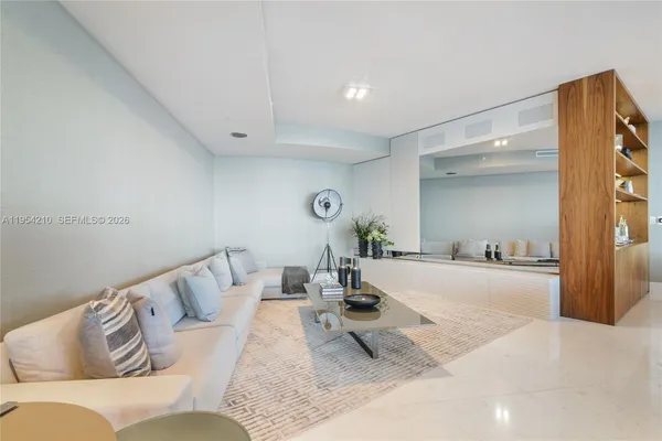 a living room with furniture and rug