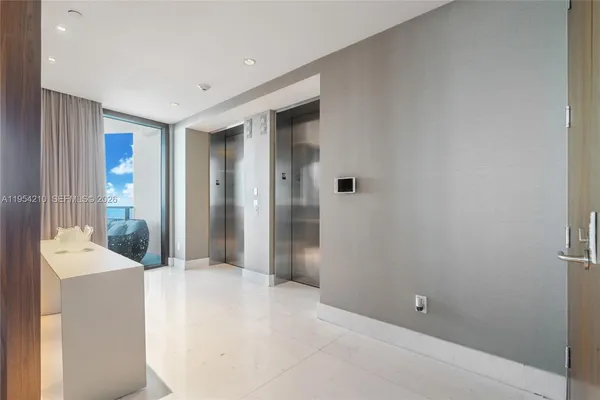 a spacious bathroom with a shower and a sink