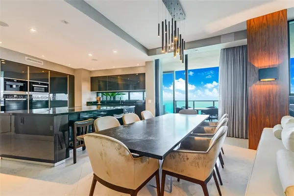a view of a dining room with furniture window and outside view