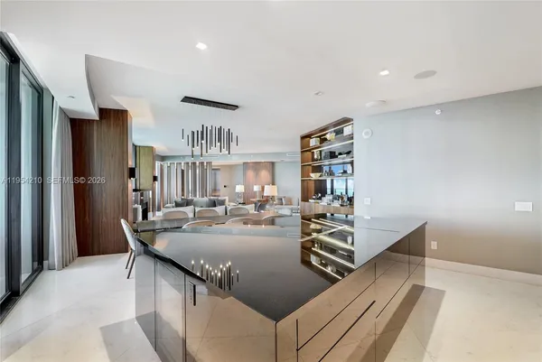 a kitchen with sink refrigerator and cabinets