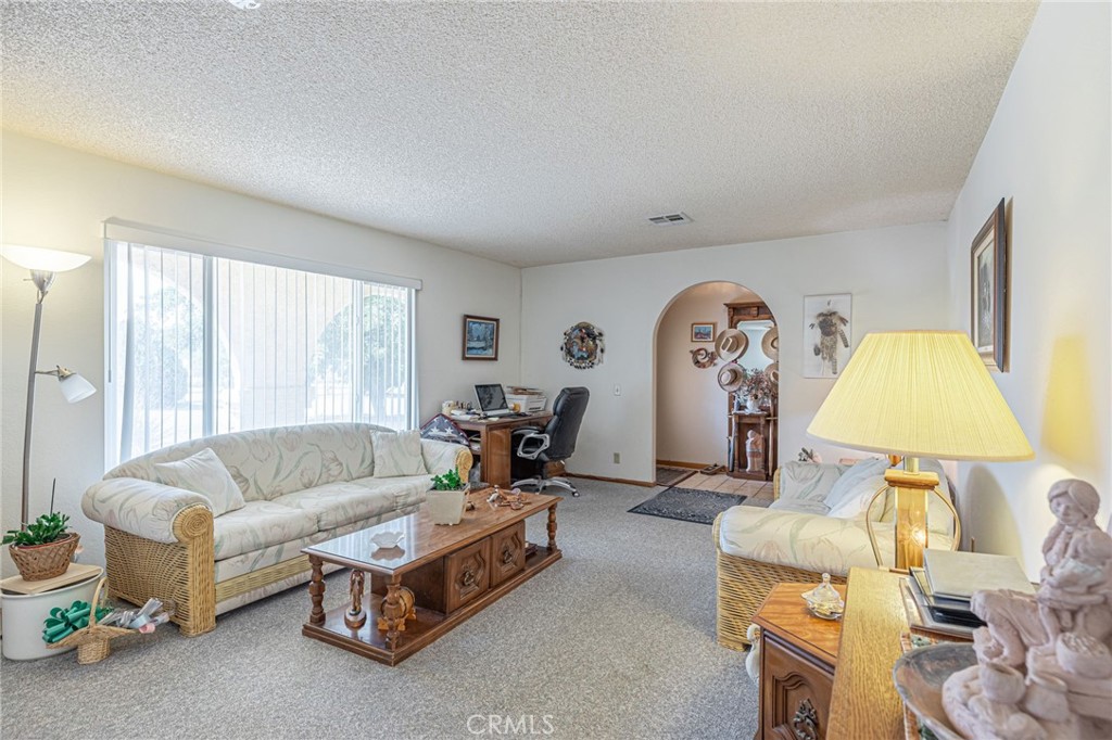 8541 West Ave D Lancaster, CA 93536 - Photo 16 of 62 a living room with furniture and a large window