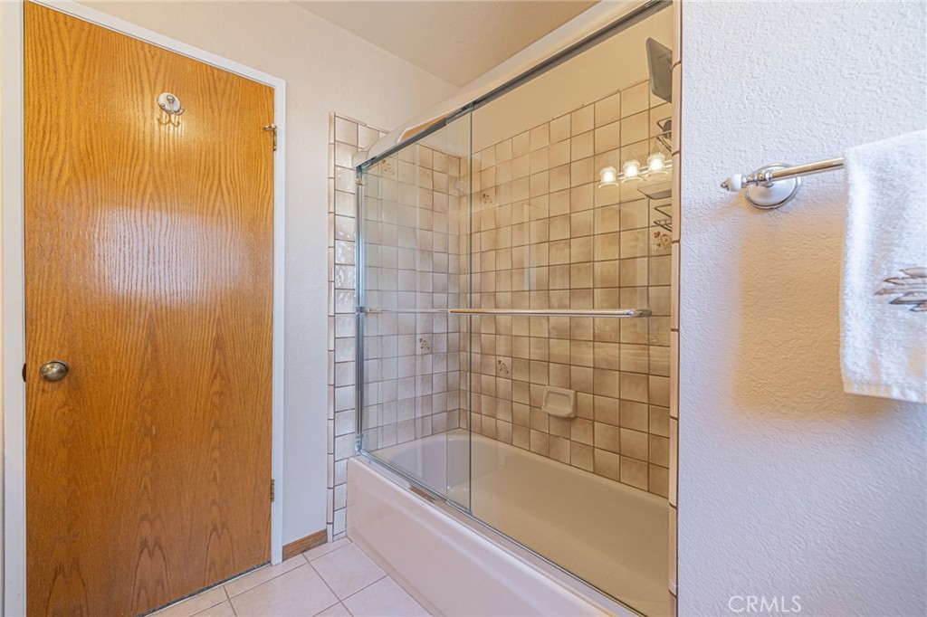 8541 West Ave D Lancaster, CA 93536 - Photo 22 of 62 a bathroom with a bathtub and shower