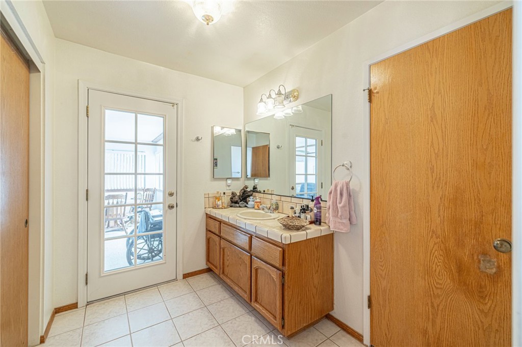 8541 West Ave D Lancaster, CA 93536 - Photo 25 of 62 a kitchen with a sink stove and cabinets