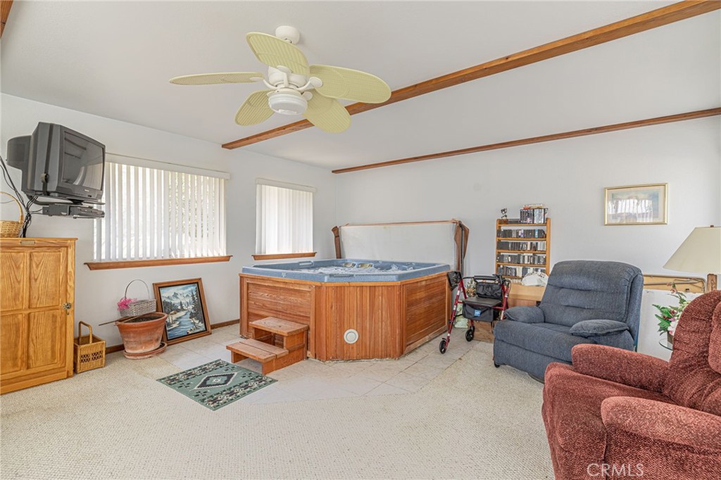 8541 West Ave D Lancaster, CA 93536 - Photo 27 of 62 a living room with furniture and a flat screen tv