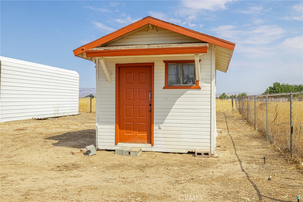 8541 West Ave D Lancaster, CA 93536 - Photo 38 of 62 a view of a house with wooden fence