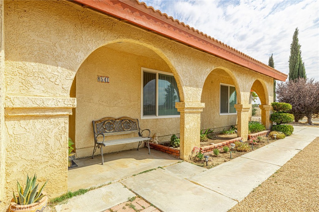 8541 West Ave D Lancaster, CA 93536 - Photo 8 of 62 a front view of a house with outdoor seating