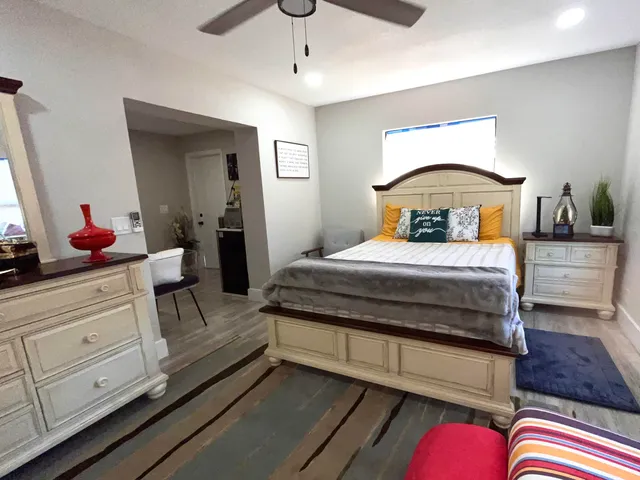 a bedroom with bed and window