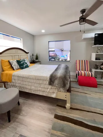 a bedroom with a bed and a dresser