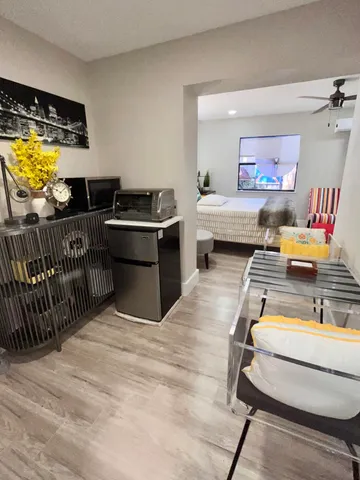 a bedroom with furniture and window